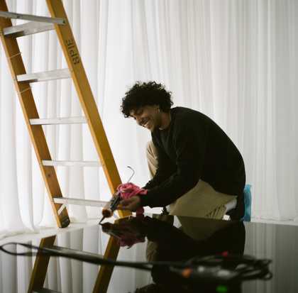 Set designer gluing a platform together