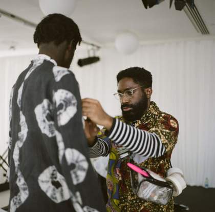 Stylist dressing a musician