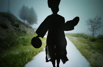 film still by joan jonas of a womans silhouette