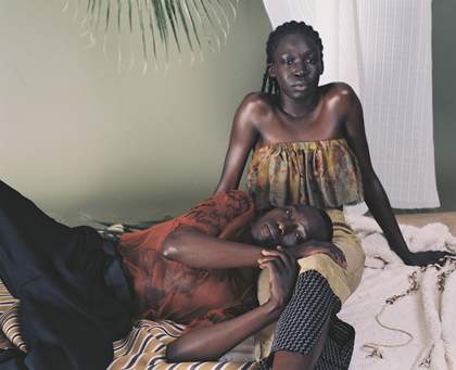 A man laying in a womans lap