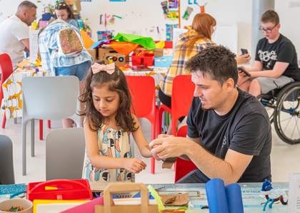 Families in Tate Liverpool's studio enjoying free craft activities