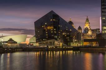 A night time photograph of the Mann Island building on Liverpool's waterfront