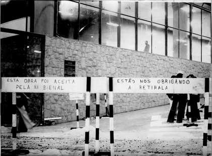 Exterior facade of the building with striped construction barriers