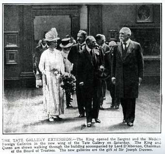 Newspaper cutting that shows the King and Queen with other dignitaries being shown around the Duveen galleries.