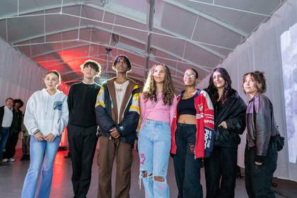 A group of young people standing in a gallery space at Tate Liverpool