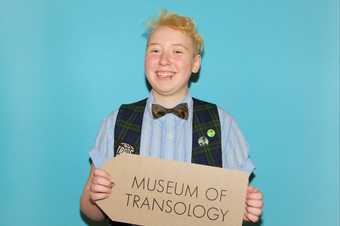 Colin Lievens holding the Museum of Transology sign