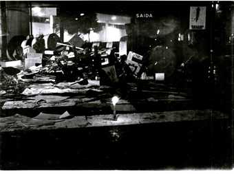 Dark shadowy image showing piles of mess and debris