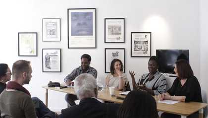 Photograph of symposium speakers and attendees