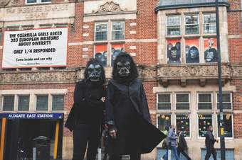 Two members of the Guerrilla Girls standing outside the Whitechapel Gallery
