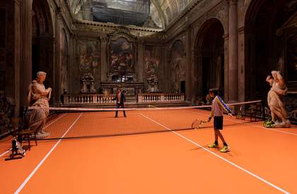 A photograph of two people playing tennis inside a grand and ornate church.