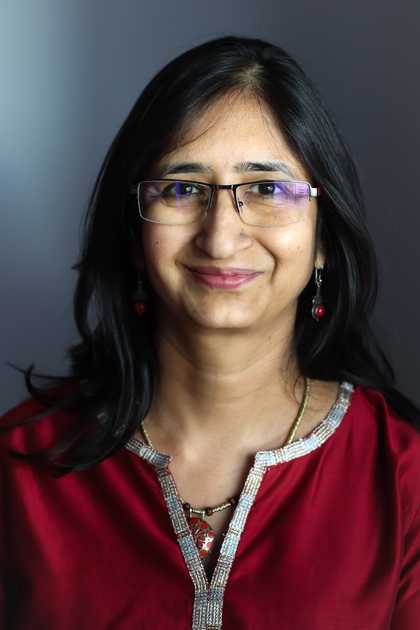 A woman looks to camera