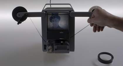 A portrait of a man is on a small strange device