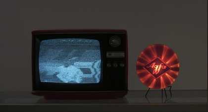 A TV set with a fuzzy black and white image 