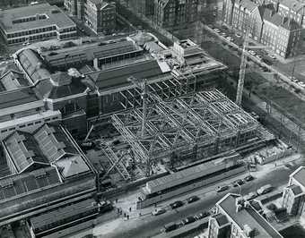 Black and white image of a construction site taken from above.