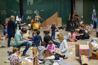 Families make using cardboard in the Turbine Hall at Tate Modern