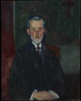 Portrait of a man in a dark suit and tie