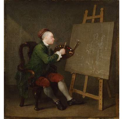 A person sits on a chair holding a paintbrush and palette up to a canvas positioned on an easel