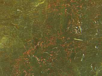 Red and green mottled paint with fine cracks