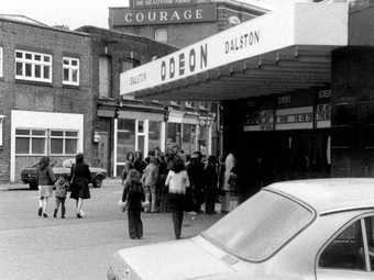 John Smith The Girl Chewing Gum 1976 (film still) cinema queue
