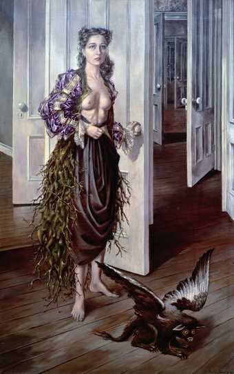 This is a self-portrait by Surrealist painter Dorothea Tanning. Tanning at that time in 1942 is a woman in her early thirties. She is staring at the viewer with an expressionless stare. She is wearing a Borello-style jacket but is revealing her bare chest