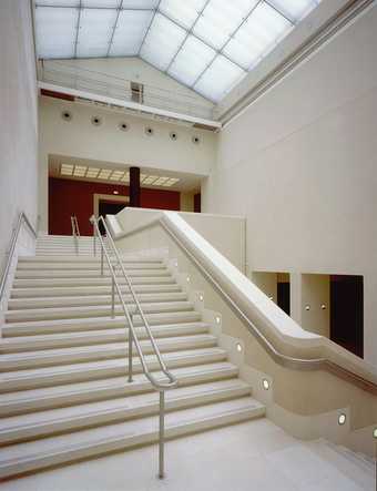 Photo of broad white stairs of the Manton staircase leading up a level in the Tate Britain gallery.