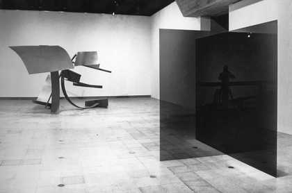 Installation view showing Larry Bell, Untitled 1971–2 (right) and David Evison, Number Six 1975 in The Condition of Sculpture: A Selection of Recent Sculpture by Younger British and Foreign Artists, Hayward Gallery, London, 1975