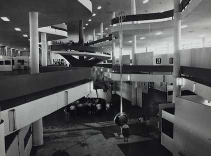 Photograph showing all the different open levels of the pavilion with columns running the full height of the space