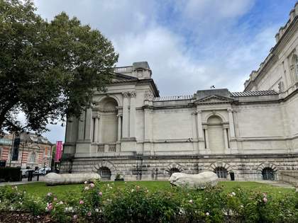 two marrow-like sculptures sit on the lawn outside Tate Britain gallery