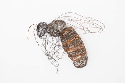 Sculpture of a bee made of very fine wire