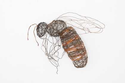Sculpture of a bee made of very fine wire