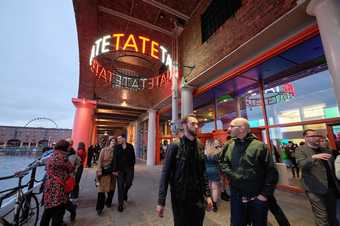 People standing or walking outside the entrance of Tate Liverpool