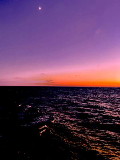 A photograph of the sea and sunset