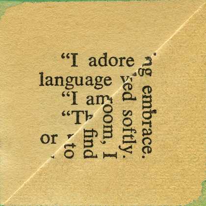 a page with printed text is folded diagonally, cropping the words.