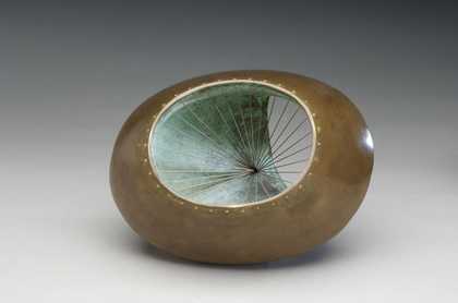 Sculpture with hollowed centre and sides connected with strings.