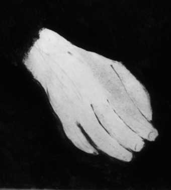 Detail of the hand that rests on the figure’s lap, showing underdrawn lines.
