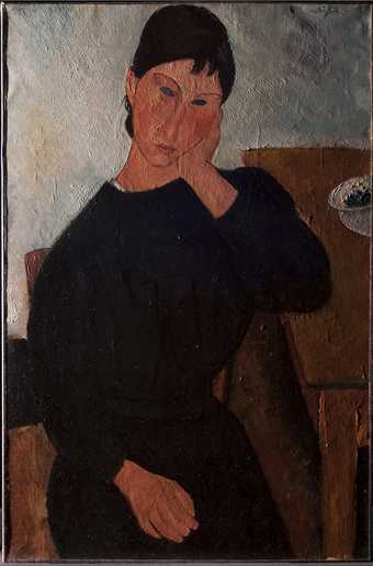 Photograph in raking light, revealing the height of the impasto and the directional brushwork that matches the figure’s gaze towards the lower right.