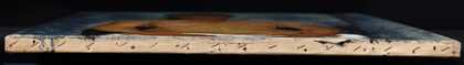 Close-up photograph of the edge of the painting.