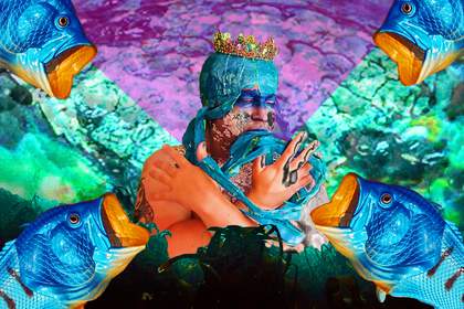 Artist Alex Billingham in a turquoise headdress with a gold crown holding her arms in a cross, surrounded by green and purple seawater, nets and fish.