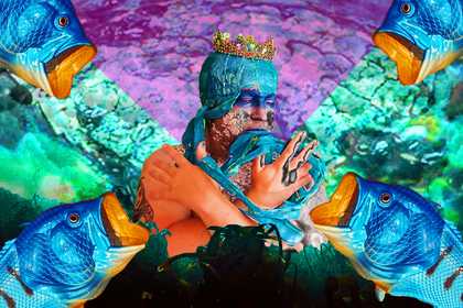 Artist Alex Billingham in a turquoise headdress with a gold crown holding her arms in a cross, surrounded by green and purple seawater, nets and fish.