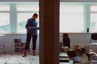 Hannah Quinlan and Rosie Hastings pictured in their studio, working on a fresco