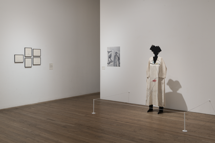 installation image of the Huguette Caland's display which shows a sculpture of a figure