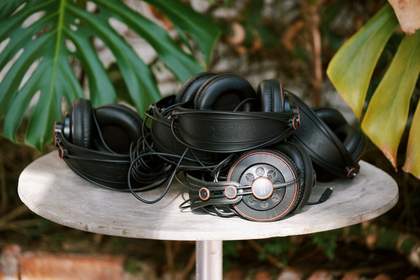 A pile of headphones on a table within Barbara Hepworth's Garden