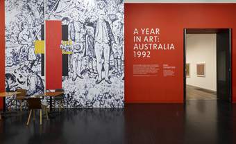 Entrance to exhibition space, large lettering and graphics on the wall.