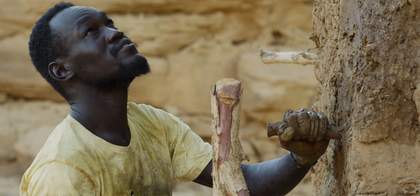 A man against a rock face