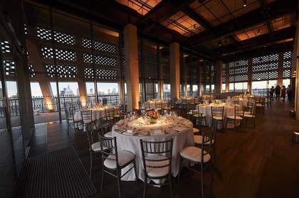 Tables and chairs set for a large dinner event