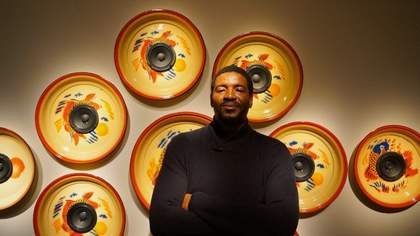 Man in front of artwork