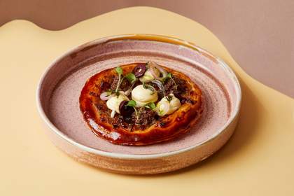 Dish of food showing the French dish 'Pissaladiere'