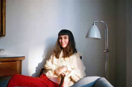 Woman reclining on a sofa