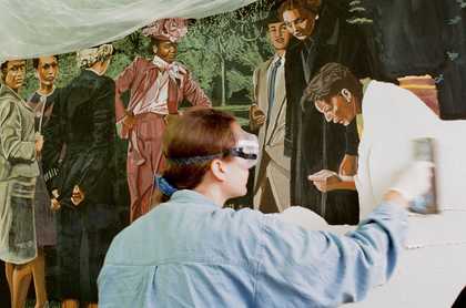Rosie Hastings, wearing goggles, applies plaster to a partially painted fresco