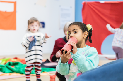 Image of two children playing in the studio in bright colours